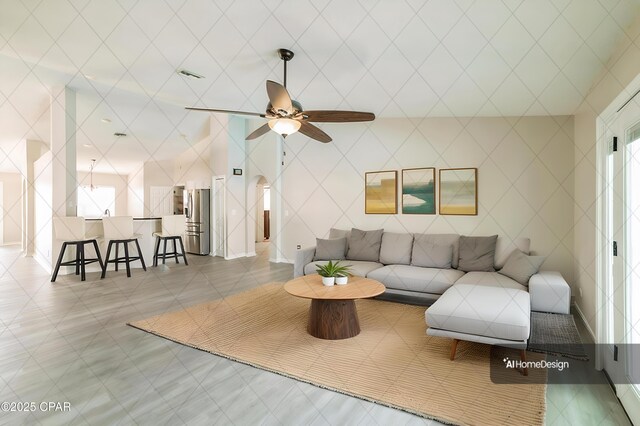 living room featuring visible vents and ceiling fan