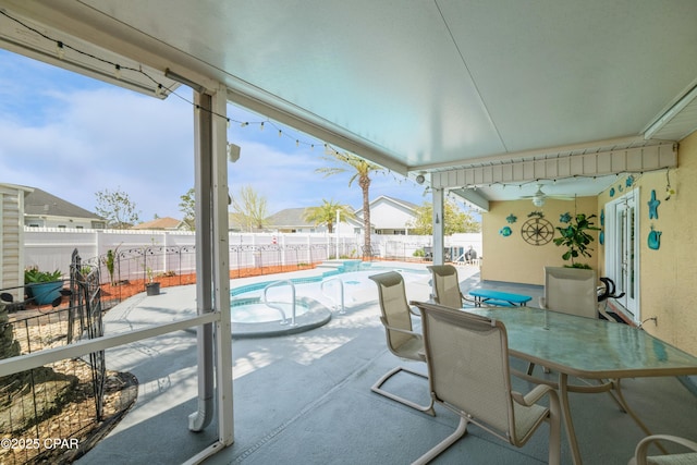 view of patio / terrace with a fenced in pool, outdoor dining area, a fenced backyard, and a ceiling fan