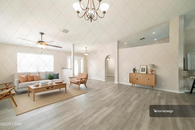 living room featuring ceiling fan with notable chandelier, baseboards, and visible vents