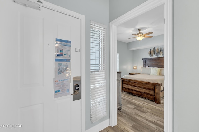 corridor featuring wood finished floors