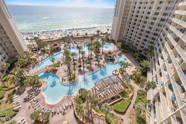 drone / aerial view with a water view and a view of the beach