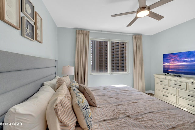 bedroom featuring baseboards and ceiling fan