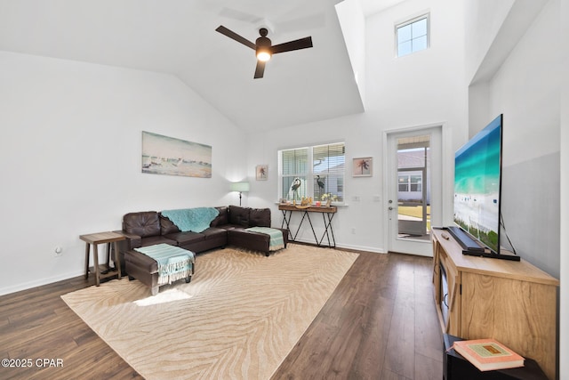 8453 Landshark Blvd, Panama City Beach, FL 32413 - living area with high vaulted ceiling, ceiling fan, baseboards, and dark wood finished floors