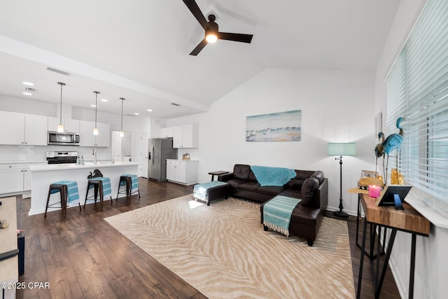 8453 Landshark Blvd, Panama City Beach, FL 32413 - living room with dark wood finished floors, a ceiling fan, and vaulted ceiling