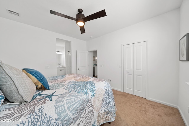 8453 Landshark Blvd, Panama City Beach, FL 32413 - bedroom featuring a closet, a ceiling fan, visible vents, light carpet, and baseboards