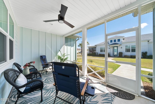 8453 Landshark Blvd, Panama City Beach, FL 32413 - sunroom / solarium with a residential view and a ceiling fan