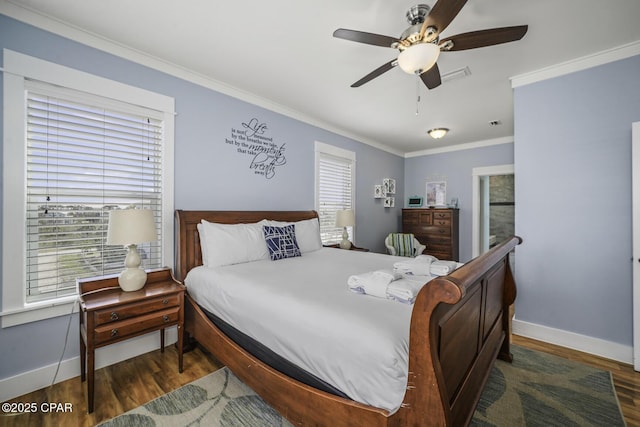 123 Sapodilla Ln, Port St Joe, FL 32456 - bedroom with wood finished floors, baseboards, ornamental molding, and a ceiling fan