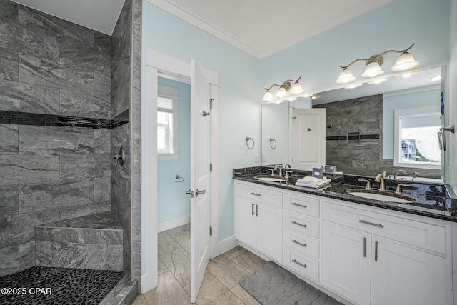 123 Sapodilla Ln, Port St Joe, FL 32456 - full bathroom featuring marble look tile flooring, a walk in shower, double vanity, baseboards, and ornamental molding