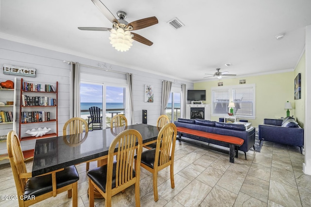 123 Sapodilla Ln, Port St Joe, FL 32456 - dining room featuring ceiling fan and crown molding
