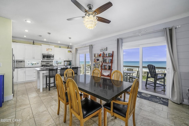 123 Sapodilla Ln, Port St Joe, FL 32456 - dining room featuring ornamental molding, a ceiling fan, a water view, and recessed lighting