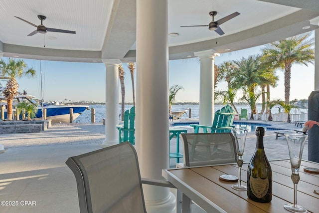 4522 Bay Point Rd, Panama City Beach, FL 32408 - view of patio / terrace with a community pool, a water view, and ceiling fan