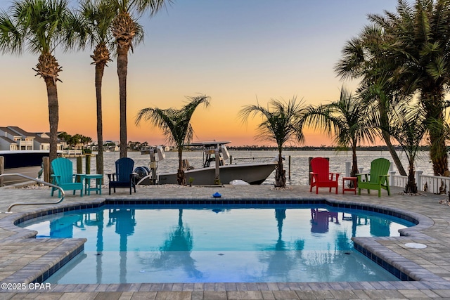 4522 Bay Point Rd, Panama City Beach, FL 32408 - community pool featuring a dock, boat lift, a water view, and a patio area