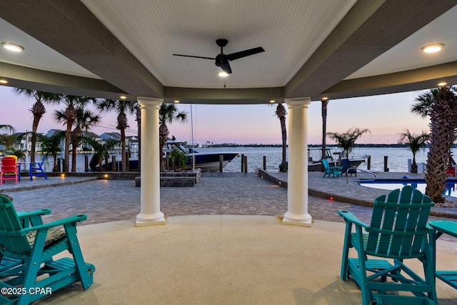 4522 Bay Point Rd, Panama City Beach, FL 32408 - patio terrace at dusk with a water view and ceiling fan