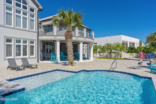4522 Bay Point Rd, Panama City Beach, FL 32408 - view of swimming pool featuring a fenced in pool, fence, and a patio