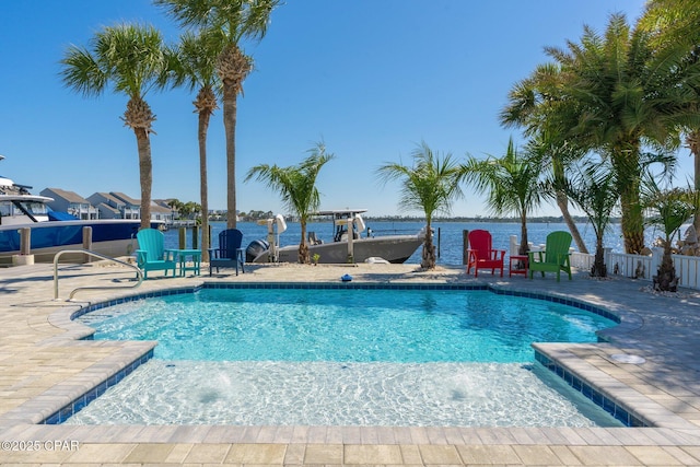 4522 Bay Point Rd, Panama City Beach, FL 32408 - pool with fence, a water view, a patio, and a dock