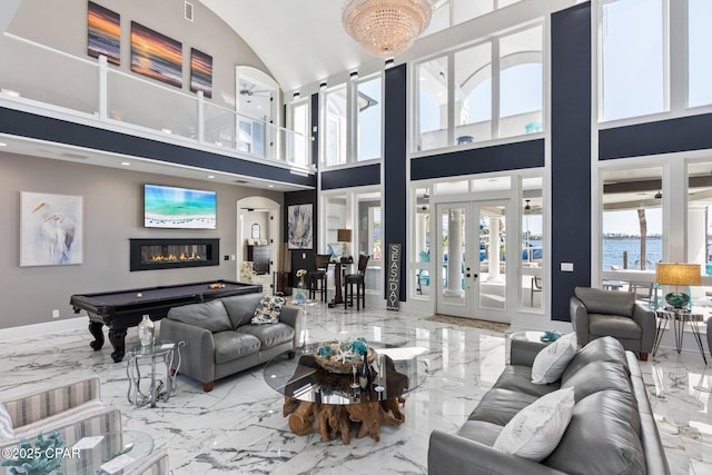 4522 Bay Point Rd, Panama City Beach, FL 32408 - living area with french doors, marble finish floor, pool table, and baseboards