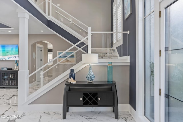 4522 Bay Point Rd, Panama City Beach, FL 32408 - interior space featuring arched walkways, marble finish floor, baseboards, and recessed lighting