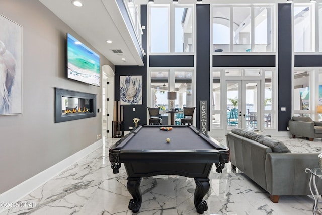 4522 Bay Point Rd, Panama City Beach, FL 32408 - game room with marble finish floor, baseboards, visible vents, and french doors