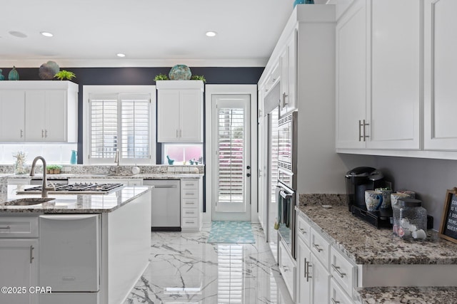 4522 Bay Point Rd, Panama City Beach, FL 32408 - kitchen featuring white cabinetry, recessed lighting, marble finish floor, light stone counters, and appliances with stainless steel finishes