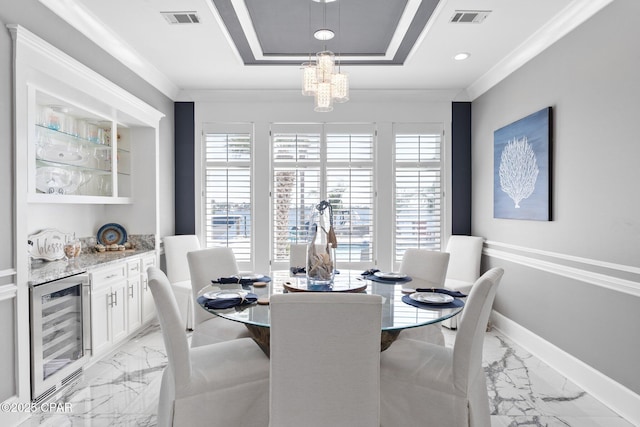 4522 Bay Point Rd, Panama City Beach, FL 32408 - dining space featuring a tray ceiling, beverage cooler, marble finish floor, visible vents, and a healthy amount of sunlight