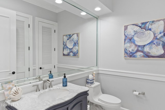 4522 Bay Point Rd, Panama City Beach, FL 32408 - half bath with recessed lighting, toilet, ornamental molding, and vanity