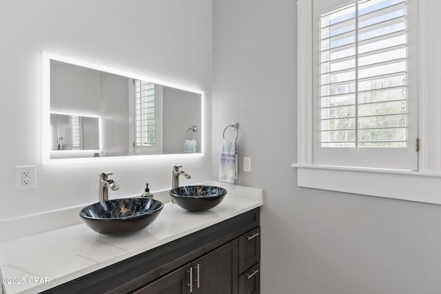 4522 Bay Point Rd, Panama City Beach, FL 32408 - bathroom featuring double vanity and a sink