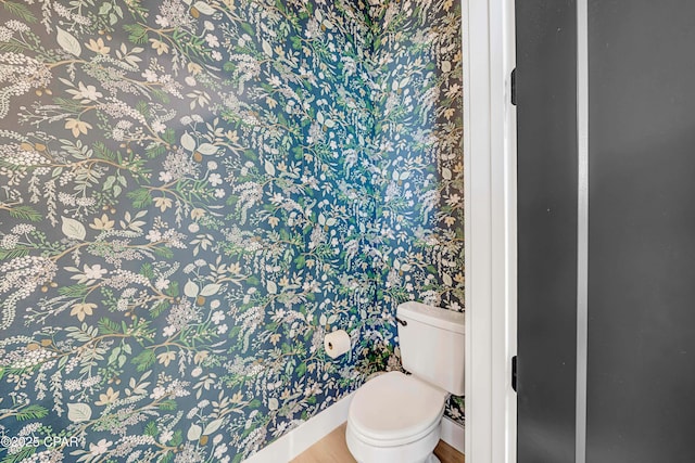 7603 Coastal Hammock Trl, Panama City Beach, FL 32413 - bathroom with wallpapered walls, toilet, and wood finished floors