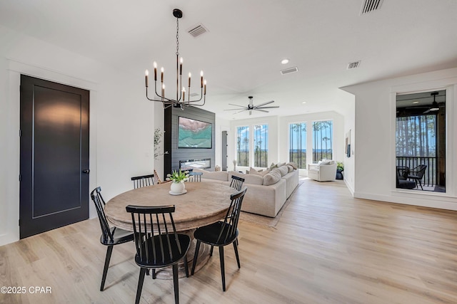 7603 Coastal Hammock Trl, Panama City Beach, FL 32413 - dining area featuring light wood-style flooring, a chandelier, a ceiling fan, baseboards, and recessed lighting
