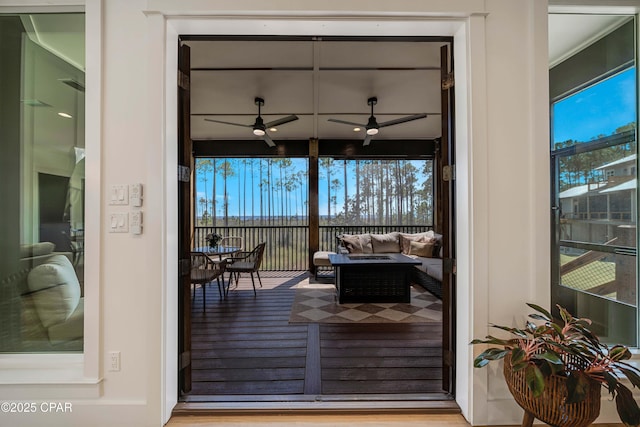7603 Coastal Hammock Trl, Panama City Beach, FL 32413 - doorway to outside with healthy amount of natural light, a ceiling fan, and wood finished floors