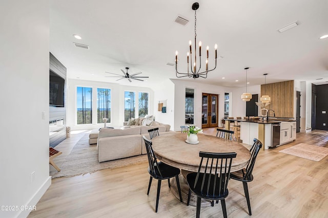 7603 Coastal Hammock Trl, Panama City Beach, FL 32413 - dining area with ceiling fan, light wood-style flooring, a chandelier, recessed lighting, and baseboards