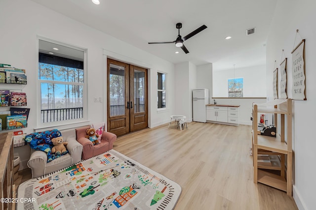 7603 Coastal Hammock Trl, Panama City Beach, FL 32413 - living area with french doors, plenty of natural light, light wood-type flooring, and recessed lighting