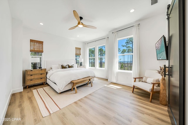 7603 Coastal Hammock Trl, Panama City Beach, FL 32413 - bedroom with light wood-style floors, recessed lighting, baseboards, and a ceiling fan