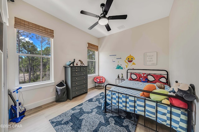 7603 Coastal Hammock Trl, Panama City Beach, FL 32413 - bedroom with wood finished floors, baseboards, and ceiling fan
