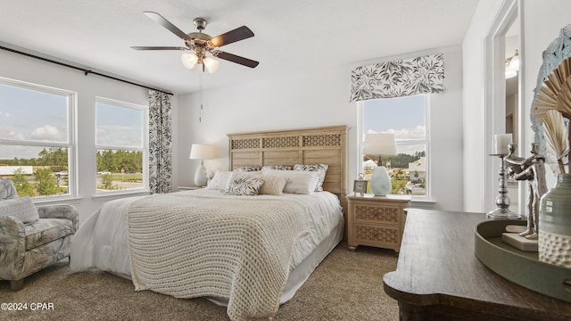 carpeted bedroom featuring ceiling fan