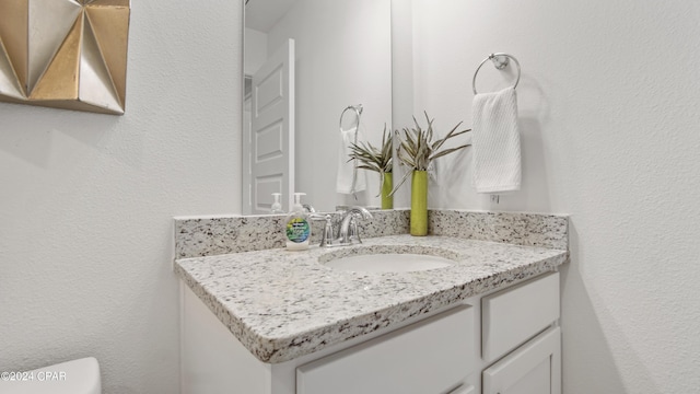 half bath with toilet and vanity