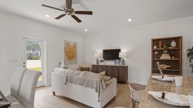 living room with recessed lighting, a ceiling fan, and baseboards