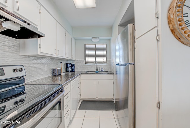 5801 Thomas Dr Unit 919, Panama City Beach, FL 32408 - kitchen featuring white cabinets, a sink, appliances with stainless steel finishes, under cabinet range hood, and light tile patterned floors
