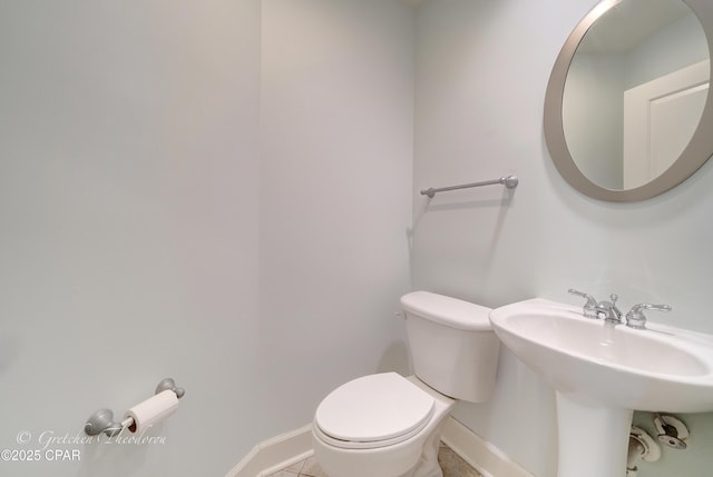8700 Front Beach Rd Unit 5101, Panama City Beach, FL 32407 - half bath featuring baseboards, toilet, and tile patterned flooring