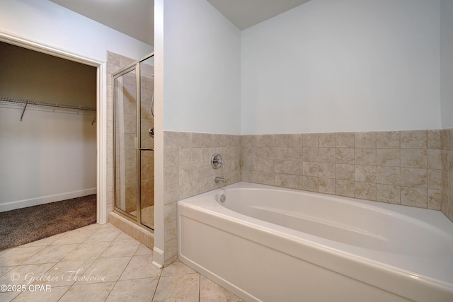 8700 Front Beach Rd Unit 5101, Panama City Beach, FL 32407 - full bath with a shower stall, tile patterned floors, a bath, and a walk in closet