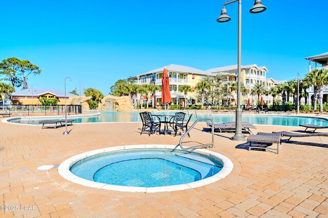 8700 Front Beach Rd Unit 5101, Panama City Beach, FL 32407 - community pool featuring a patio