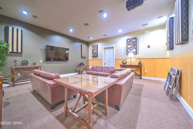 8700 Front Beach Rd Unit 5101, Panama City Beach, FL 32407 - carpeted living room with a textured wall, recessed lighting, and wooden walls