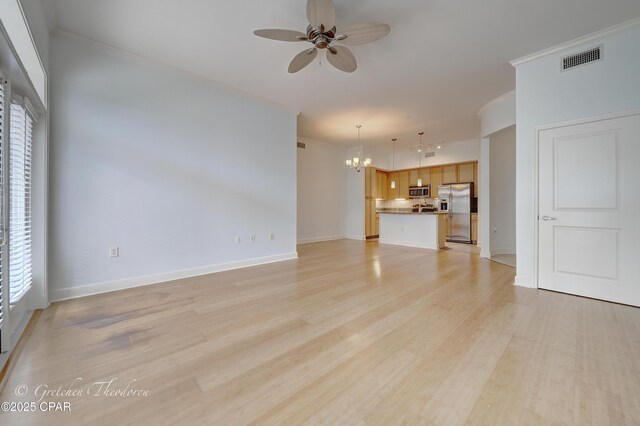 8700 Front Beach Rd Unit 5101, Panama City Beach, FL 32407 - unfurnished living room with a ceiling fan, a chandelier, crown molding, light wood-style flooring, and baseboards