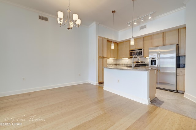 8700 Front Beach Rd Unit 5101, Panama City Beach, FL 32407 - kitchen featuring appliances with stainless steel finishes, backsplash, crown molding, light brown cabinetry, and a kitchen island with sink