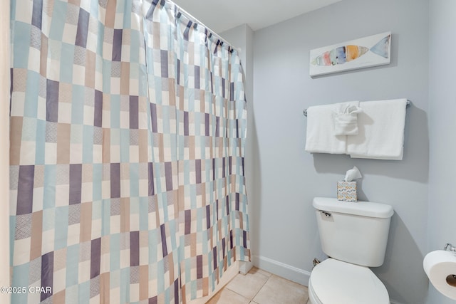 full bathroom featuring a shower with curtain, baseboards, toilet, and tile patterned flooring