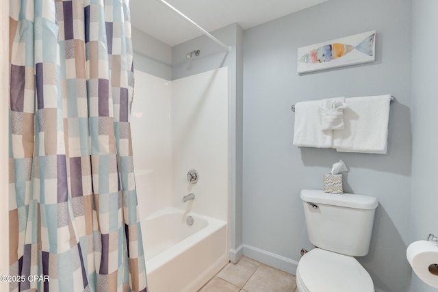 full bathroom with tile patterned flooring, shower / bath combo, toilet, and baseboards