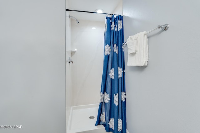bathroom featuring a stall shower