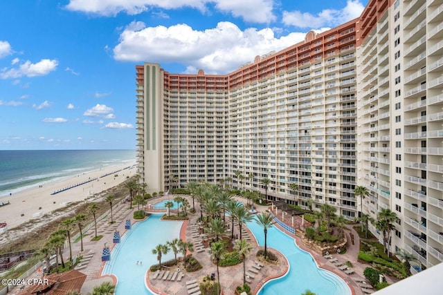 exterior space featuring a view of the beach and a water view