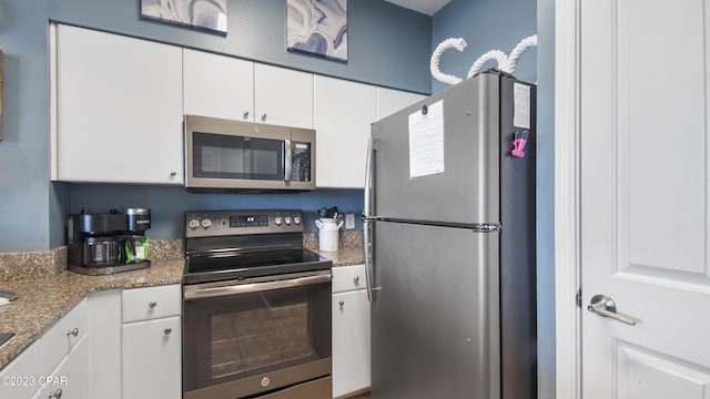 kitchen with white cabinets and stainless steel appliances