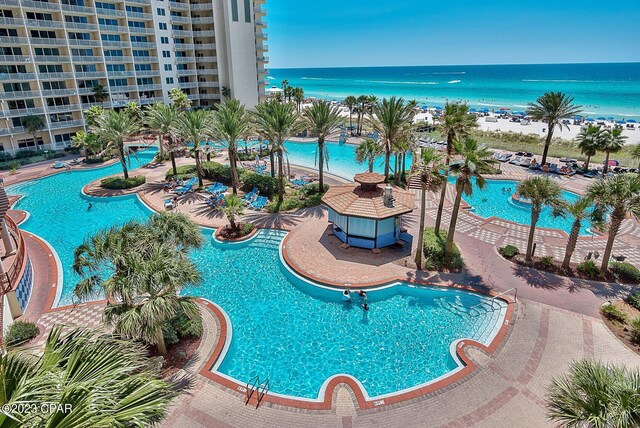 pool with a water view and a view of the beach