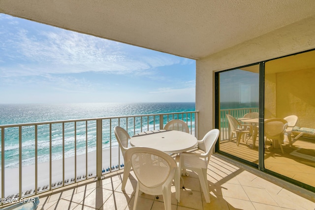 5801 Thomas Dr Unit 1216, Panama City Beach, FL 32408 - balcony with a view of the beach, outdoor dining space, and a water view